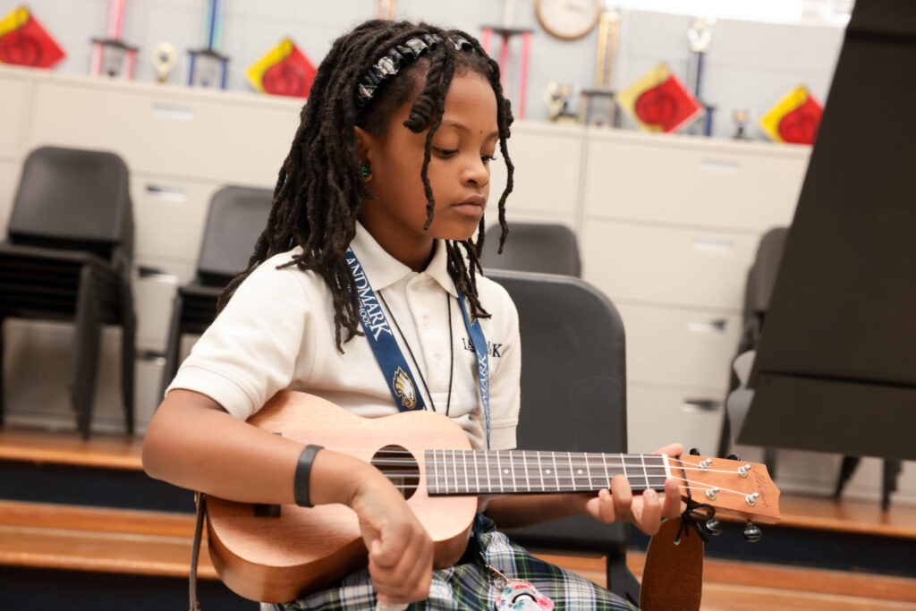 girl playing guitar