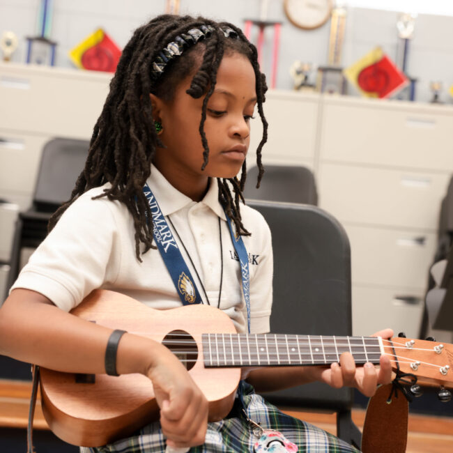 girl playing guitar